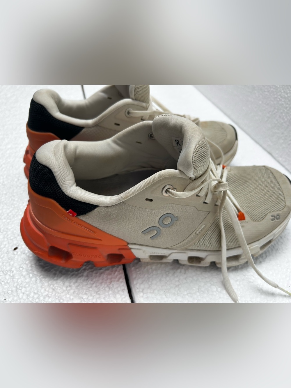 On Running Women’s Trail Sneakers in Cream with Orange Accent 8.5